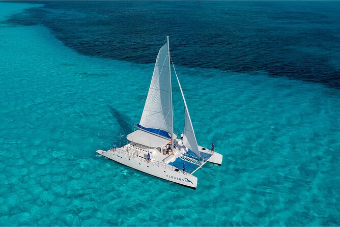 HipHop Catamaran Party from Cancun to Isla Mujeres - Snorkeling beside underwater statues