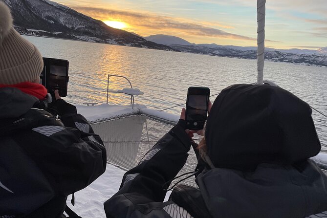 History Fjordcruise Around The Isle Of Tromso - Luxury Catamaran - A water-level view of Tromsø