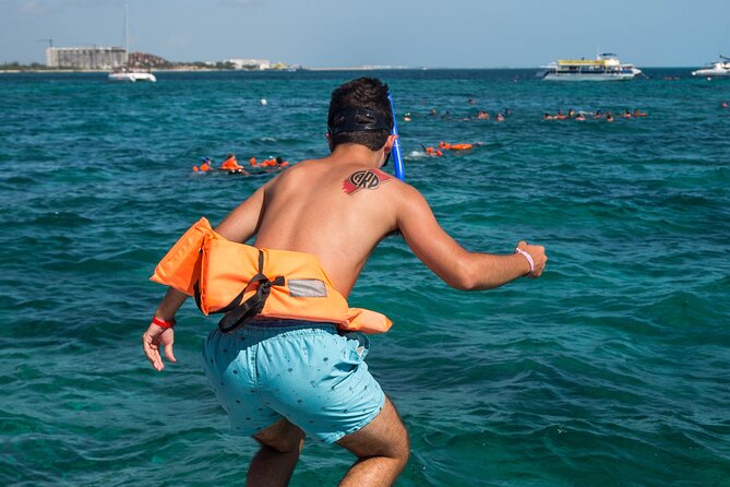 Isla Mujeres Catamaran tour with Open Bar, Lunch and Snorkeling - Transportation, timing, and what to bring
