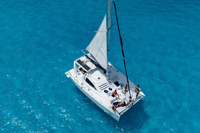 Isla Mujeres Day Tour with Catamaran, Snorkeling & Beach Club - Setting sail across Bahia Mujeres