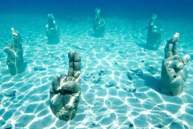 Isla Mujeres on luxury catamaran with snorkel, open bar and lunch - Who will enjoy this day most