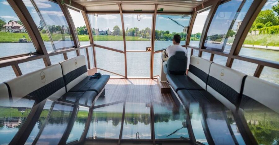 Krakow: Lazy Catamaran River Cruise and Salt Mine Group Tour - A river view of Krakow from Inflancki Boulevard