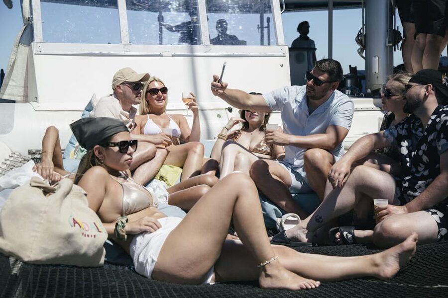 Lisbon: Catamaran Boat Party with Music, Open Bar & Dives - Music, dancing, and the open-bar tradeoff