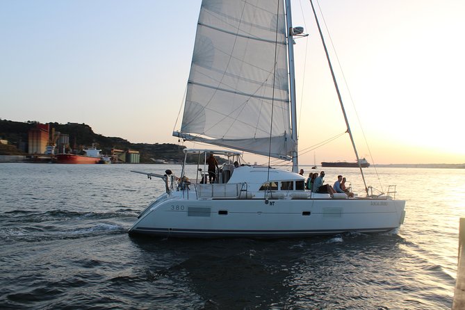 Lisbon Sailing Catamaran Public Cruise with drinks - Praça do Comércio and the old city from the river