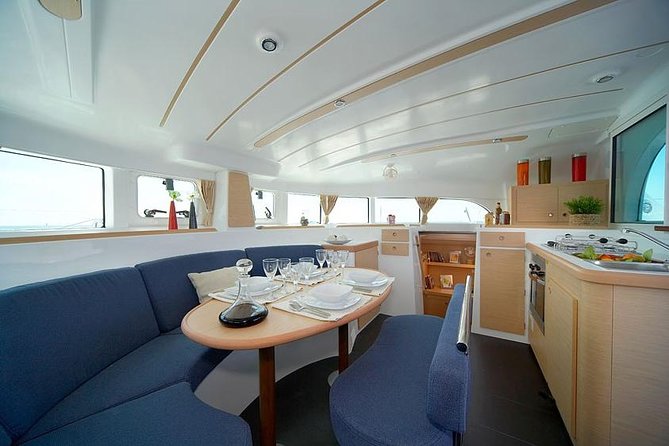 Lisbon Sailing Catamaran Public Cruise with drinks - Crossing beneath the 25 de Abril Bridge
