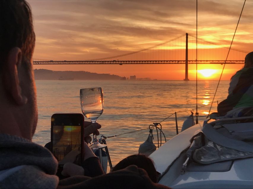 Lisbon: Sunset and Wine Luxury Catamaran Cruise - A sunset view of Lisbon that feels different