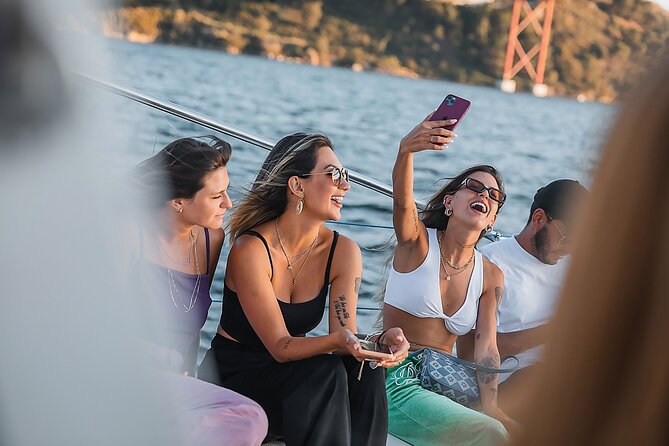 Lisbon : Sunset Catamaran Boat Tour with Music and Drinks - Under the April 25 Bridge