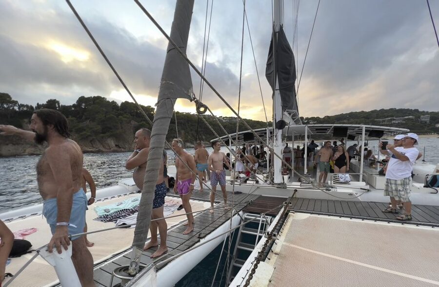 Lloret de Mar: Sunset Catamaran Cruise with DJ and Drinks - Watching the coast turn gold