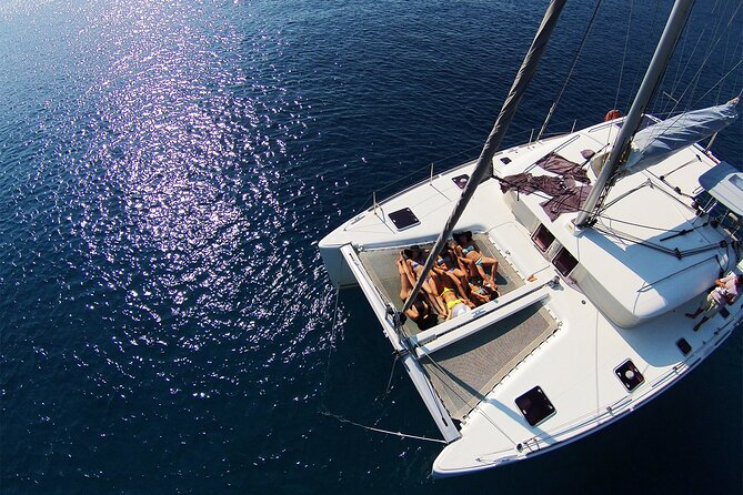 Luxury Catamaran Cruise Including pickup and Traditional Food - Two or three stops in the blue water