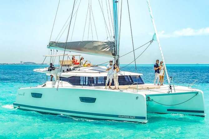 Luxury Catamaran Privilege to Isla Mujeres + Open Bar VIP - Snorkeling among fish and underwater statues