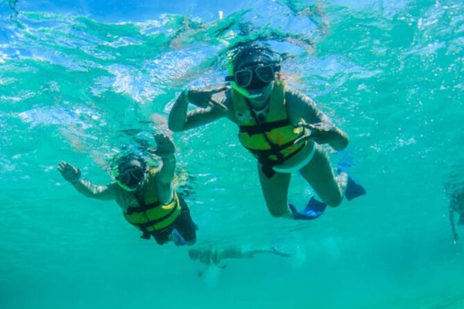 Luxury Cozumel Catamaran: Snorkel, Beach Club & Relaxation - Guided snorkeling with equipment included