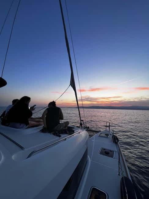 Majorca: Dinner aboard a private catamaran with snorkeling and paddle surfing - The 45-minute return and Palma after dark