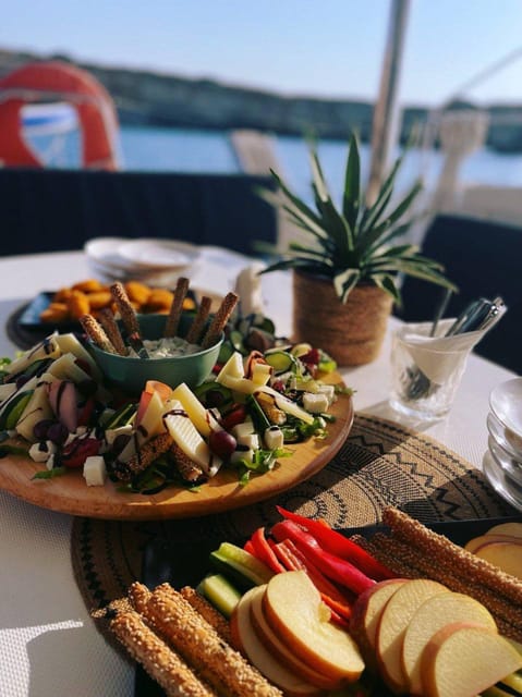 Milos: Kleftiko Sunset Catamaran Cruise with Meal & Drinks - Starting at Adamantas with coffee and local snacks