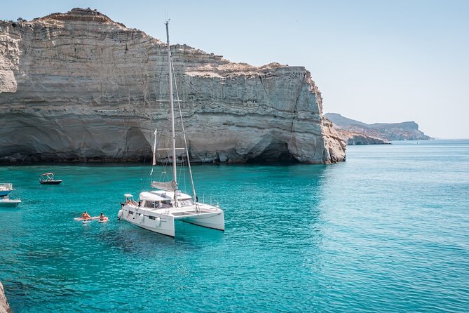Milos Private Half-Day Catamaran Cruise to Kleftiko with Lunch - Leaving Adamantas on a private catamaran