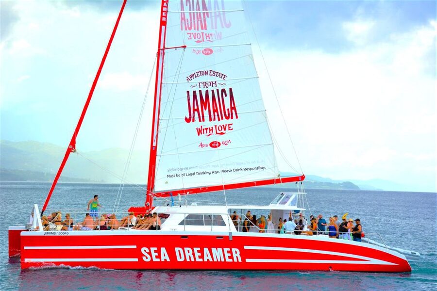Montego Bay Catamaran Cruise and Snorkeling Tour - Entering the water from the catamaran steps