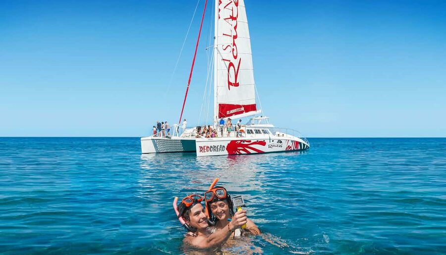 Montego Bay: Reggae Catamaran 18+ Cruise with Open Bar - A floating club with a snorkeling break