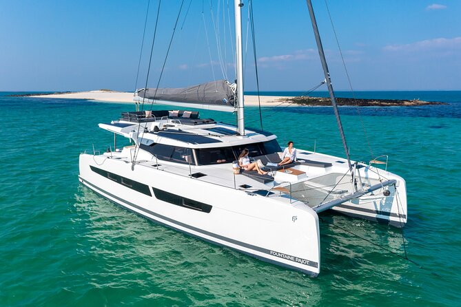 Mykonos: Brand-New Catamaran Cruise with Meal, Drinks & Transport - Rhenia or Mykonos’s southern coast