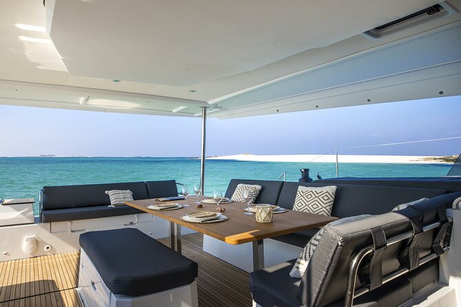 Mykonos: Luxury Catamaran Cruise with Meal, Drinks & Transport - Getting to Agia Anna and boarding by tender