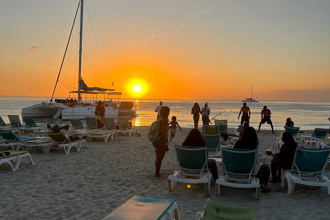 Negril Private Day Tour: ATV Ride, Party Catamaran & Ricks Cafe - Sunset, food, and cliff jumps at Rick’s Cafe