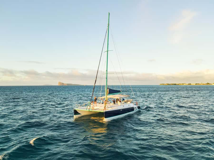 North of Mauritius: Sunset Catamaran Cruise, Drinks & Snacks - Sailing out of Grand Baie as daylight fades