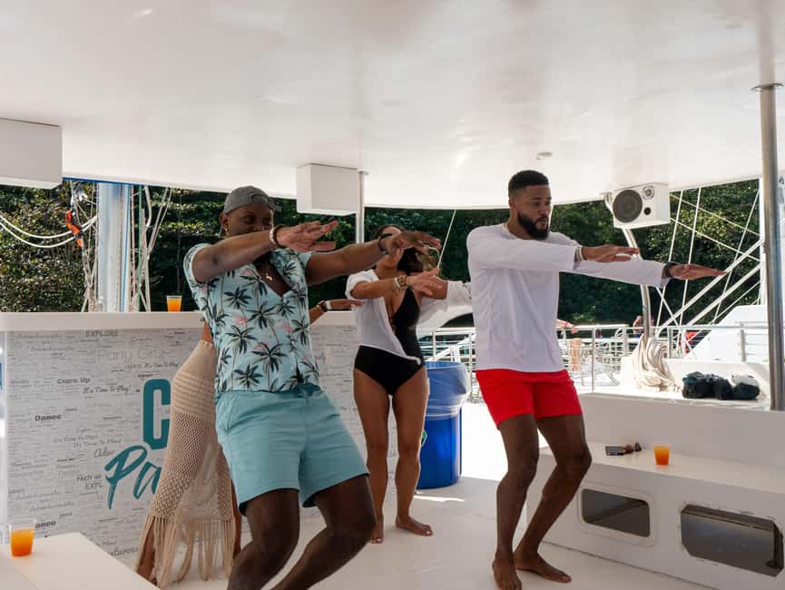 Ocho Rios: Catamaran Sail & Snorkel + Dunn's River Climb - Lunch, Island Village, and the ocean-side break