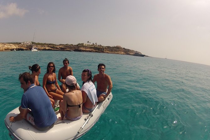 Playa de Ses Illetes Full Day Catamaran Trip - Arriving at Playa de Ses Illetes by dinghy