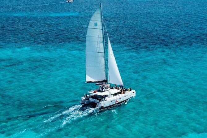 Plus Full Day Catamaran Tour to Isla Mujeres All Inclusive - Punta Sur and the beach club stop