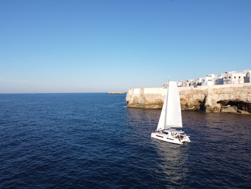 Polignano a Mare: Catamaran Tour with Aperitif & Local Food - Cala Corvino: swimming, paddleboards, and aperitivo