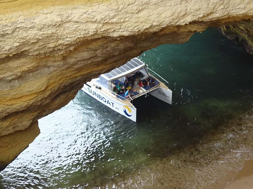 Portimao: SUNSET Benagil Caves Tour | Eco Catamaran - Along the cliffs toward Benagil