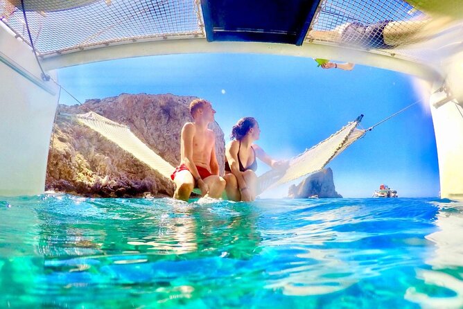 Porto Conte: Half-day catamaran tour with aperitif - Morning or afternoon?