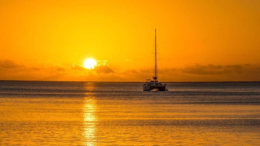 Porto Conte: Sunset catamaran excursion with aperitif - Sailing toward the Capo Caccia stacks