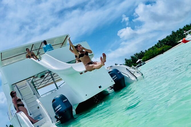 Private Catamaran Cruise with Slide & unlimited drinks - Snorkeling among coral and colorful fish