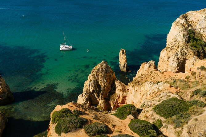Private Catamaran Tour Lagos Coast and Ponta da Piedade - A calm bay for swimming, snorkeling, and paddleboarding