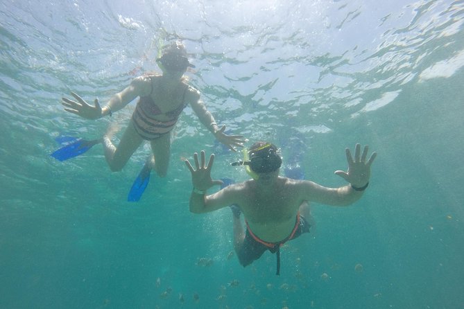 Private Catamaran Tour to Isla Mujeres with Snorkeling from Cancun - Crew service and the photography issue