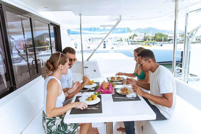Private Full Day Luxury Catamaran Excursion - Swimming and snorkeling among coral and fish