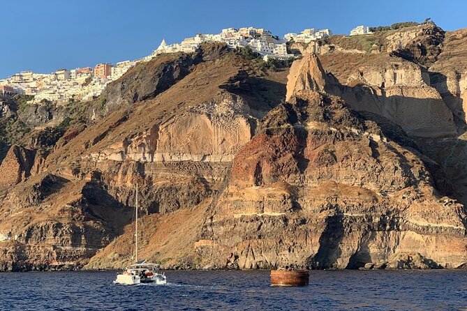 Private Luxury Santorini Catamaran Cruise with Port Pickup - Choosing daytime or sunset sailing