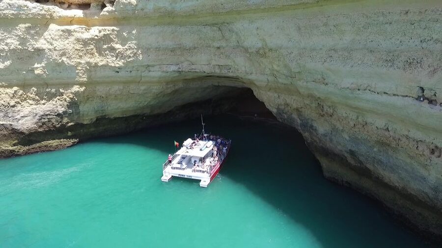 Quarteira: Benagil Cave Guided Catamaran Day Cruise & Drink - Entering Benagil Cave