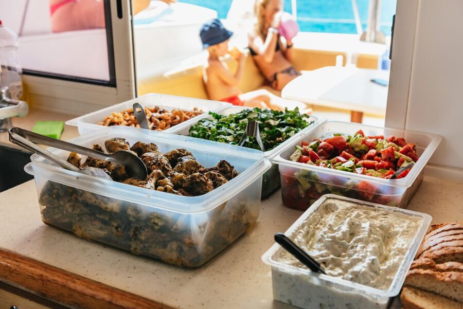 Rhodes: All-Inclusive Catamaran Cruise with Lunch and Drinks - Lunch on deck, with Greek wine and cold drinks