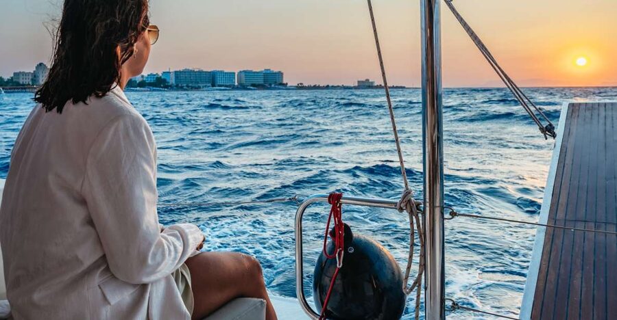 Rhodes: Sunset Catamaran Cruise with Dinner Buffet & Drinks - Sunset on the Return to Rhodes Town
