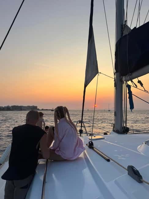 Rhodes: Sunset Catamaran Cruise with Snack, Fruits & Drinks - Fruit, drinks, and the ride back