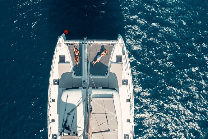 Romantic Sunset Catamaran Caldera Cruise incl. Meal & Drinks - The volcano’s thermal springs are not a hot bath