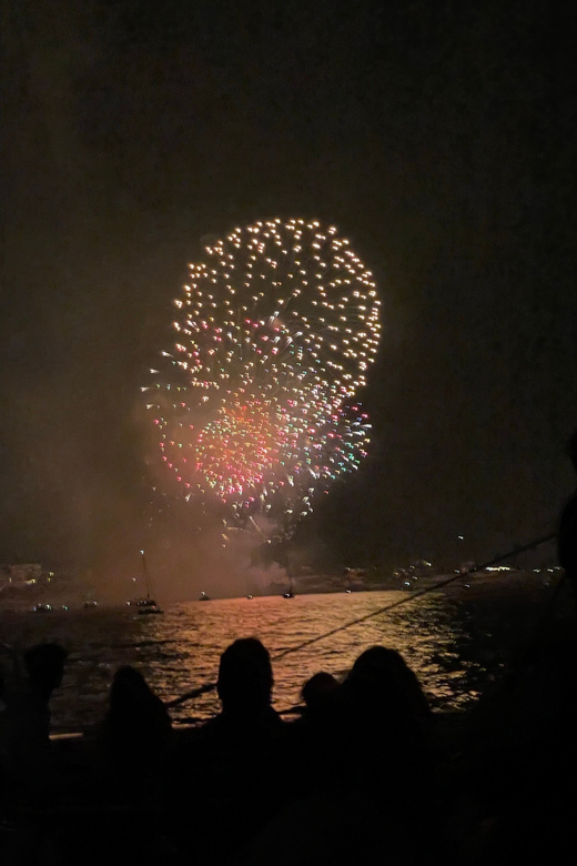 Salou's Fireworks 15th August Sail Catamaran - Waiting at sea with a drink and a Catalan cake