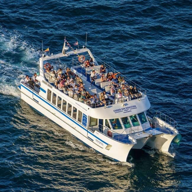 San Sebastián: Sunset Cruise on a Sustainable Catamaran - Santa Clara Island in the evening light