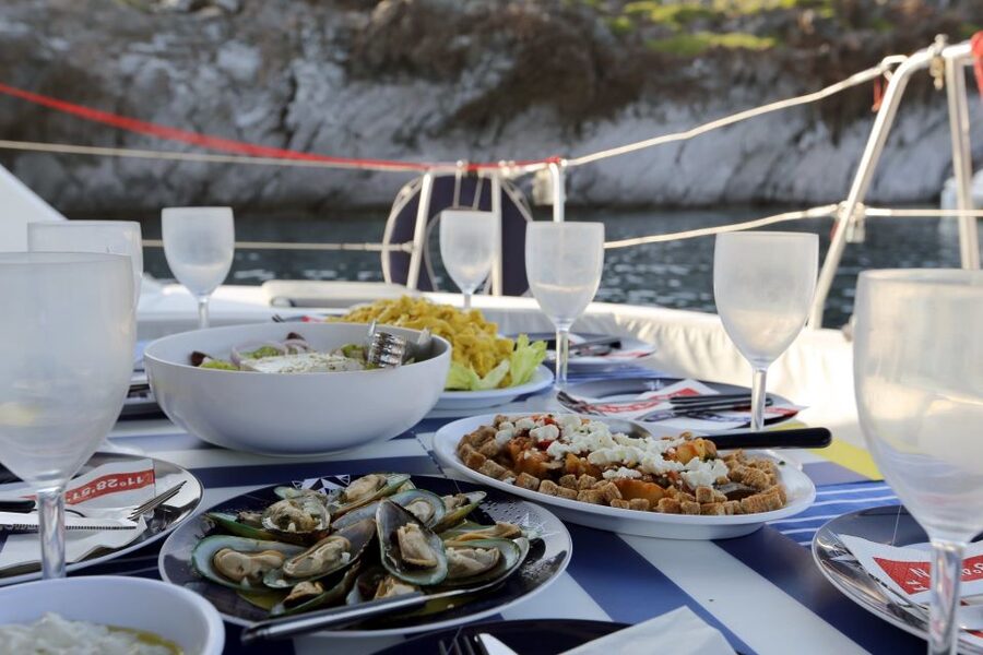 Santorini: 7-Hour Private Catamaran Cruise with Food & Drink - Lighthouse, Aspronisi, and the open-water views