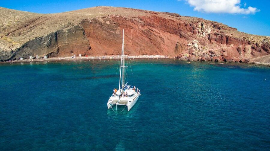 Santorini: 7-Hour Private Catamaran Cruise with Food & Drink - Lunch, swimming, and snorkeling near Oia