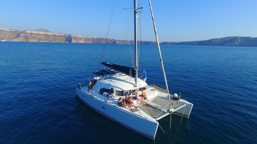 Santorini: 7-Hour Private Catamaran Cruise with Food & Drink - Passing Imerovigli and Firostefani from below