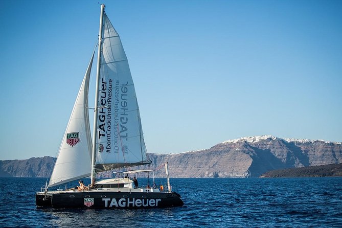 Santorini Adventurous Catamaran Experience with Snorkeling - Barbecue lunch, sunset dinner, and the open bar