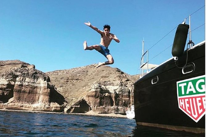 Santorini: Adventurous Catamaran Experience with Snorkeling - Red Beach and the volcanic southern coast