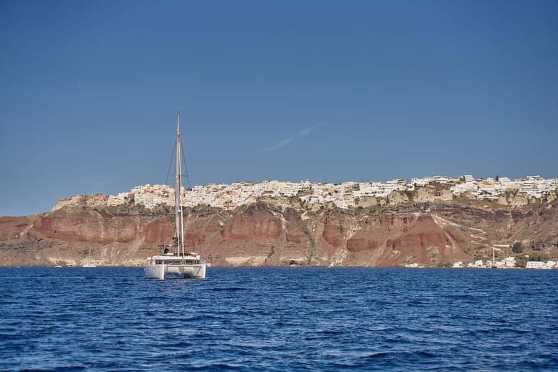 Santorini: Caldera Classic Catamaran Cruise w/ Meal & Drinks - Passing the lighthouse and Indian Face Mountain