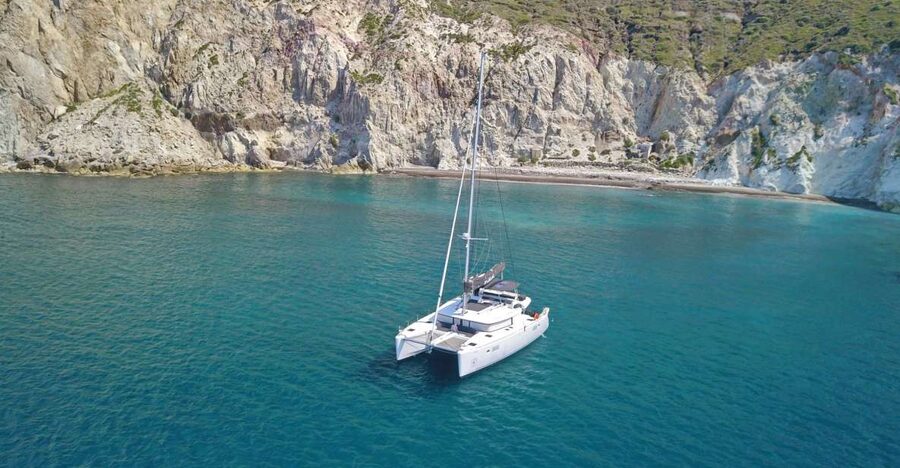 Santorini: Caldera Luxury Catamaran Cruise w/ Meal & Drinks - White Beach: a short photo stop beneath pale cliffs